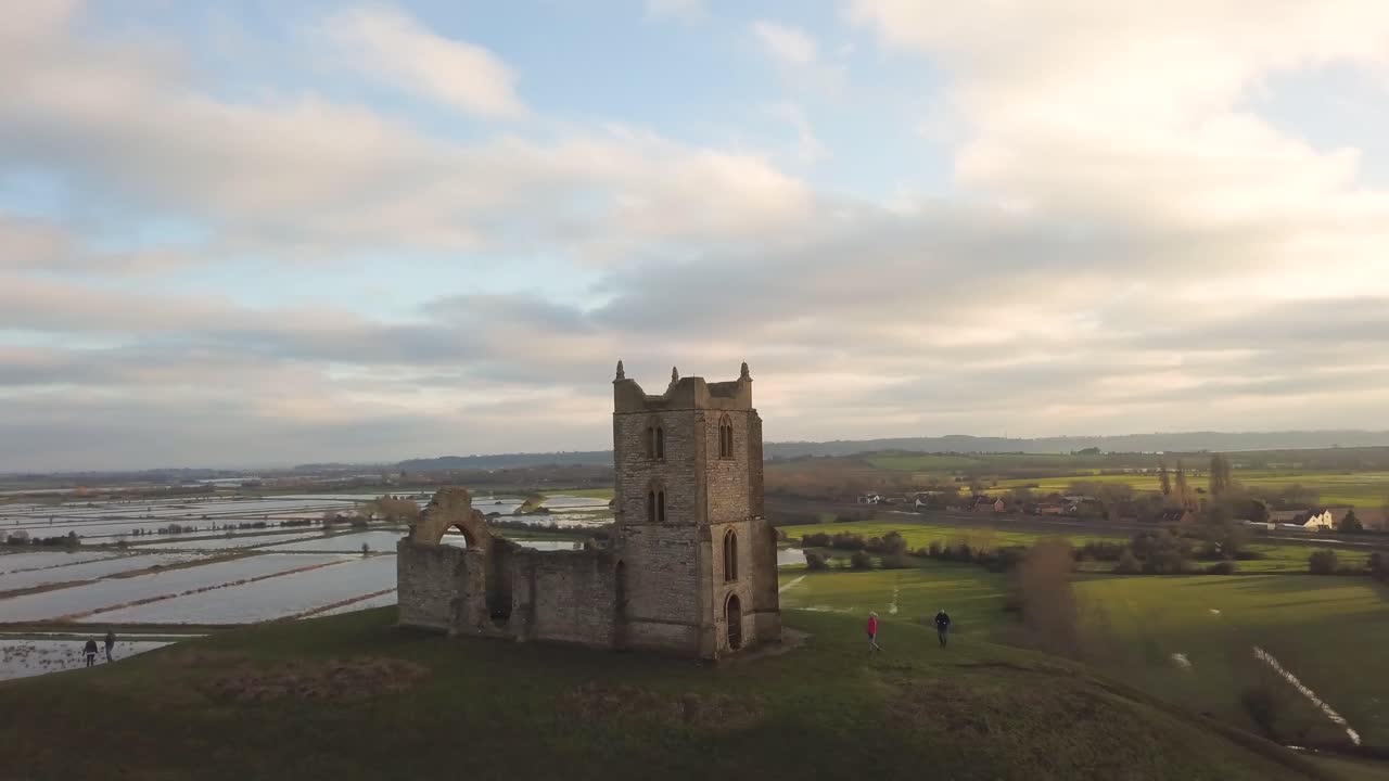 BURROWBRIDGE, SOMERSET, ENGLAND, December 29, 2019: Aerial view of Burrow Mump ruins church with flooded fields on the background.