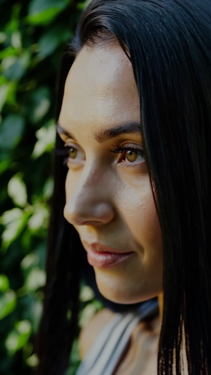 Close-up Portrait of a Serene Woman in Nature