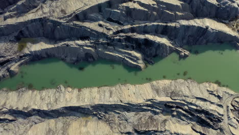 top down view of a quarry construction site with beautiful color contrasts