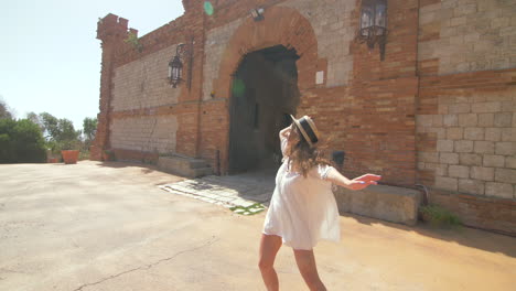 happy woman enjoying a sunny day in europe