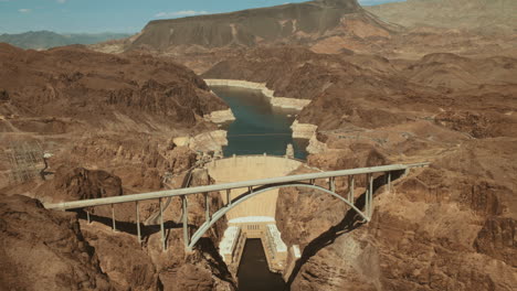 aerial wide shot of hoover dam on sunny summer hot day