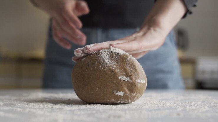 Slow motion as baking at home, pouring flour, almond flour for gluten free cookie dough or bread in the kitchen