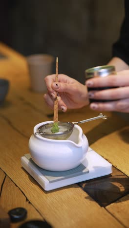 preparing matcha tea