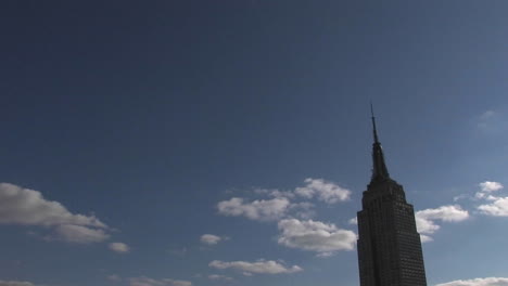 high clouds pass the empire state building