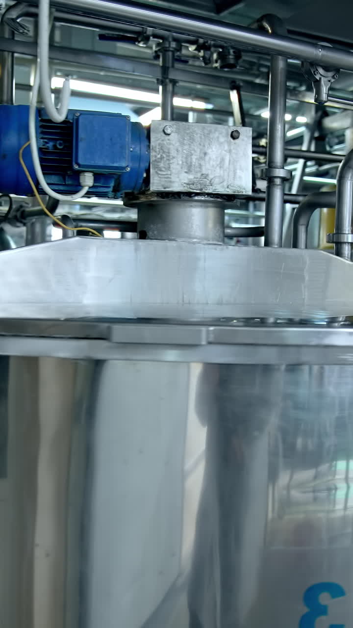 Industrial organic food making process. Modern sterilized milk production factory. Vertical video