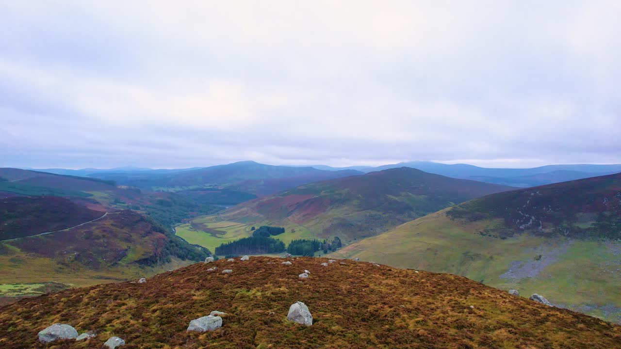 A 4K push forward shot towareds the Lough Tay Valley