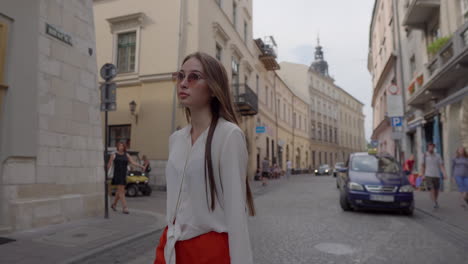 woman walking through a european city street