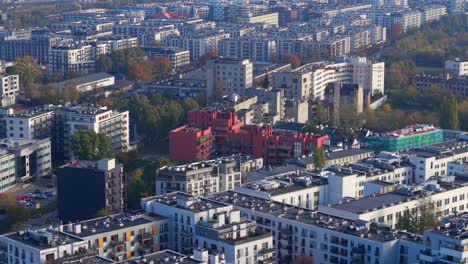 aerial view of modern residential neighborhood in warsaw, poland, apartment buildings on sunny morning, drone shot