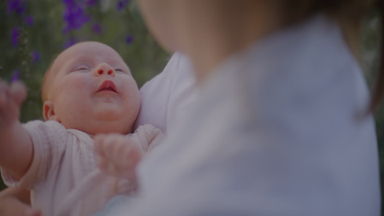 Mother Holding Crying Baby in Arms