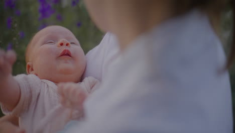 mother holding crying baby in arms