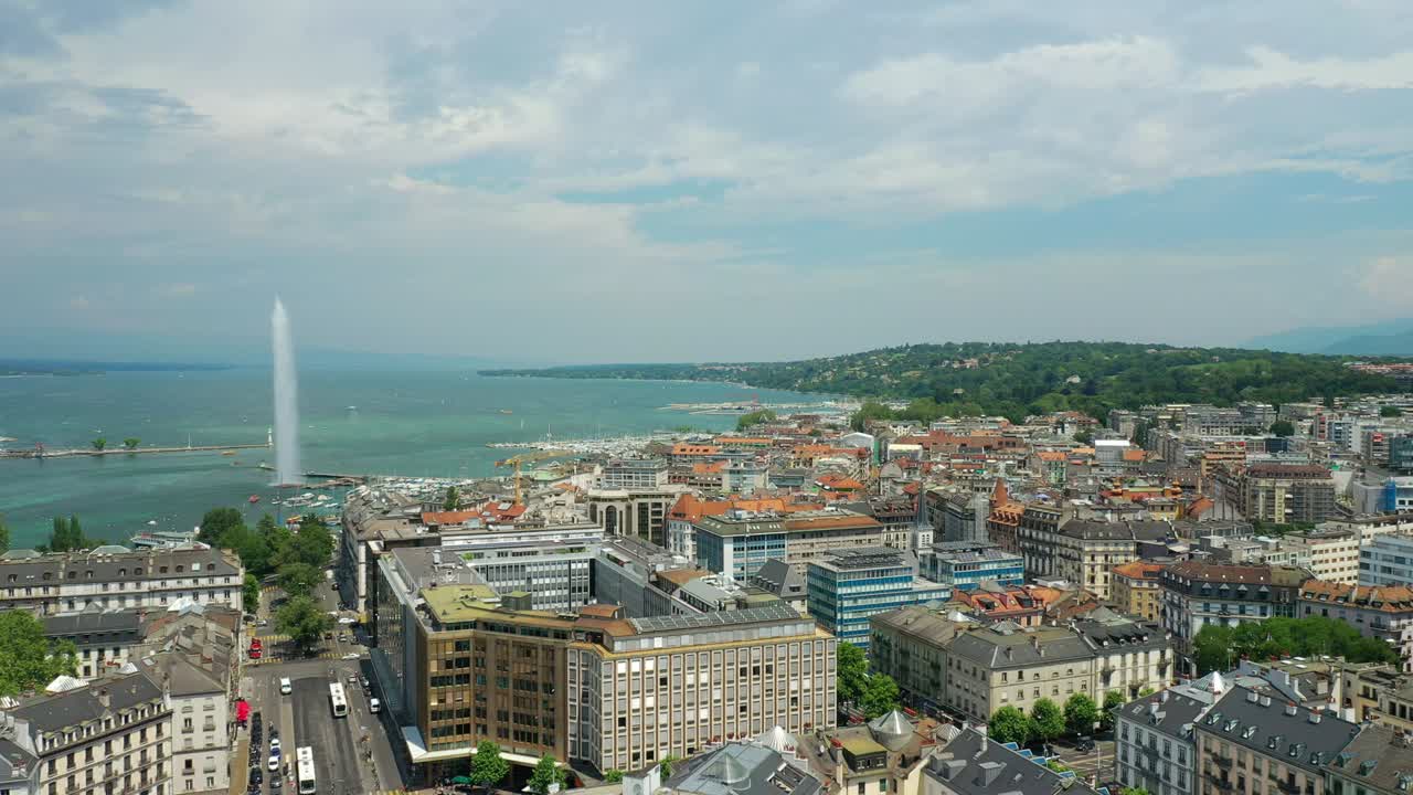 flight over sunny day geneva city lakeside fountain traffic street circle aerial panorama 4k switzerland