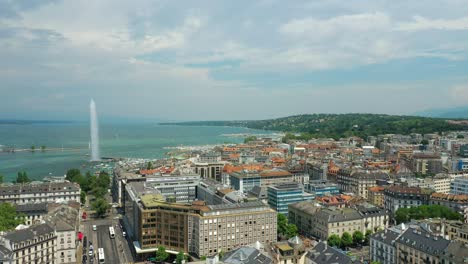 flight over sunny day geneva city lakeside fountain traffic street circle aerial panorama 4k switzerland