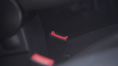 fastening a seatbelt in a car