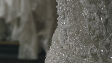 a close up of a wedding dress, which highlights the finer details