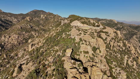 Mt-Lemmon-Arizona-Aerial-v2-low-flyover-Windy-Point-Vista-capturing-untouched-natural-landscape-of-rugged-terrain-with-unique-wind-whipped-rock-formations---Shot-with-Mavic-3-Cine---March-2022