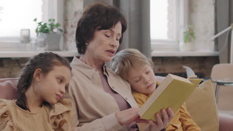 grandmother reading to grandchildren