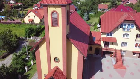 Aerial-shot-of-a-small-church-with-a-a-cross-on-top