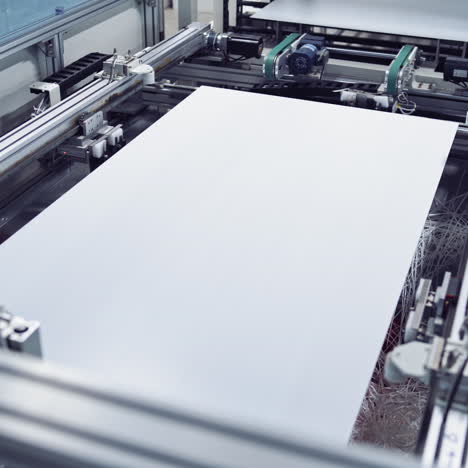 automated equipment in a modern plant. innovated technology of making panels indoors. close-up.