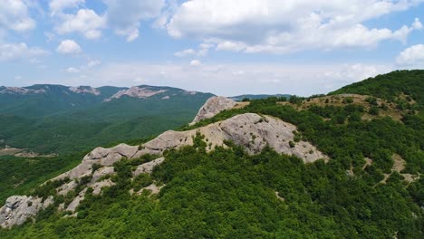 mountain scenery with forest and cloudy sky