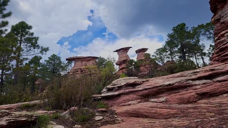 Timelapse of sky with clouds next to strangely shaped rock formations. Paroncillo corvettes. Cuenca. Spain.