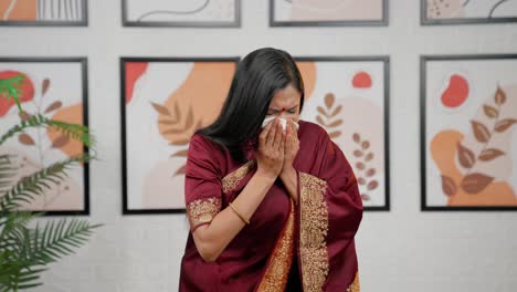 indian woman sneezing and having cold