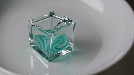 mint candy in a glass cube