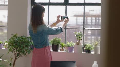 business woman architect using smartphone taking photo of building construction engineer sharing project development on social media enjoying successful career in startup office