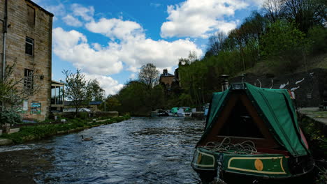 england canal with narrow boats time lapse in the spring time with footpath and people uk 4k