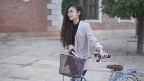 young woman riding a bicycle in the city