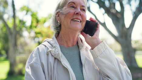 Phone-call,-happy-and-senior-woman-in-park