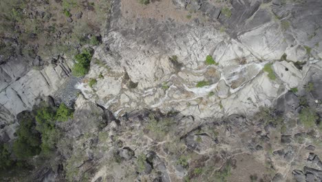 Emerald-Creek-Falls---Waterfall-Cascading-On-Granite-Boulders-Through-Rainforest-In-Mareeba,-Queensland