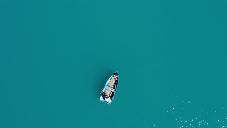 Oeschinen-Drone-shot-of-a-Rowing-boat-from-above