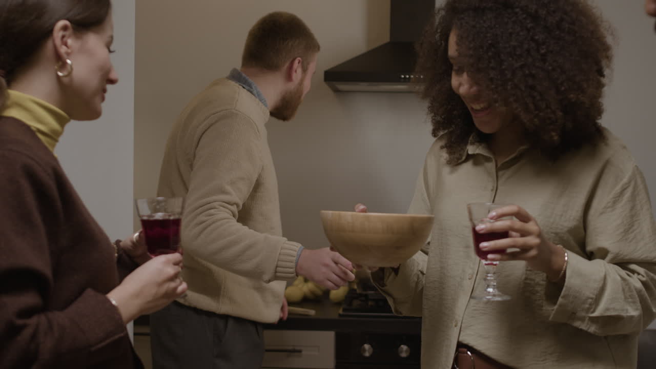 People Gathering in a Kitchen