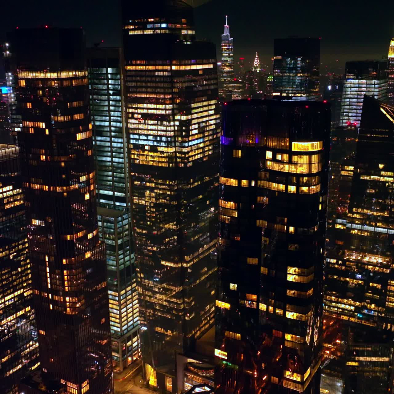 Multiple lights in the windows of amazing New York. Drone footage flying slowly among the marvelous skyscrapers