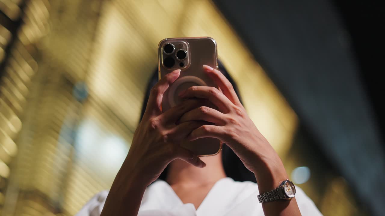 Woman Taking Photo at Night