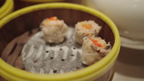 steamed shrimp dumplings in bamboo steamer