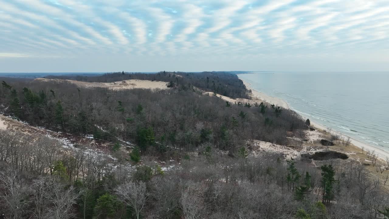 Lush and fluffy clouds over Lake Michigan's Dune covered coast