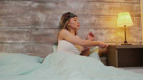 Beautiful-woman-in-pajamas-with-sleep-mask