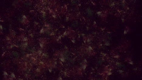 rough, textured background with scattered red and green specks