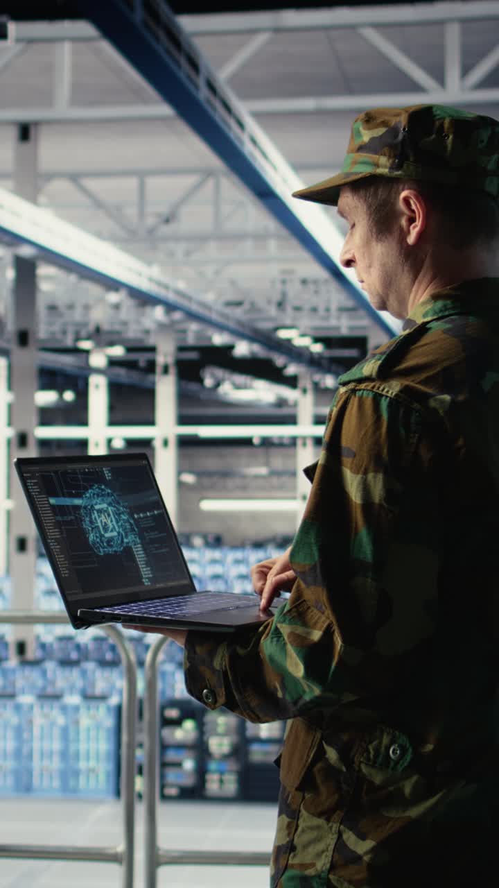 Vertical Video Soldier In Engineering Role Uses Ai On Laptop To Manage Server Hub Systems