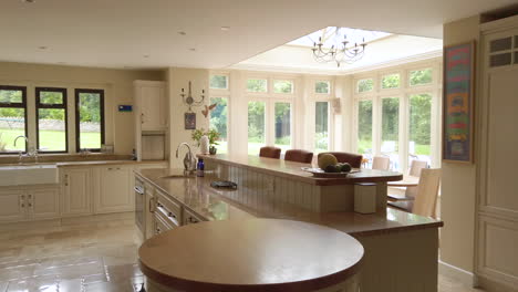 left to right pan of a large contemporary kitchen in a family home