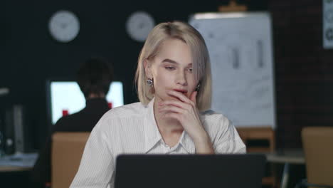 Unhappy-business-woman-throwing-document-paper-on-table-in-night-office