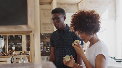 young couple buying beauty and body products in sustainable plastic free grocery store