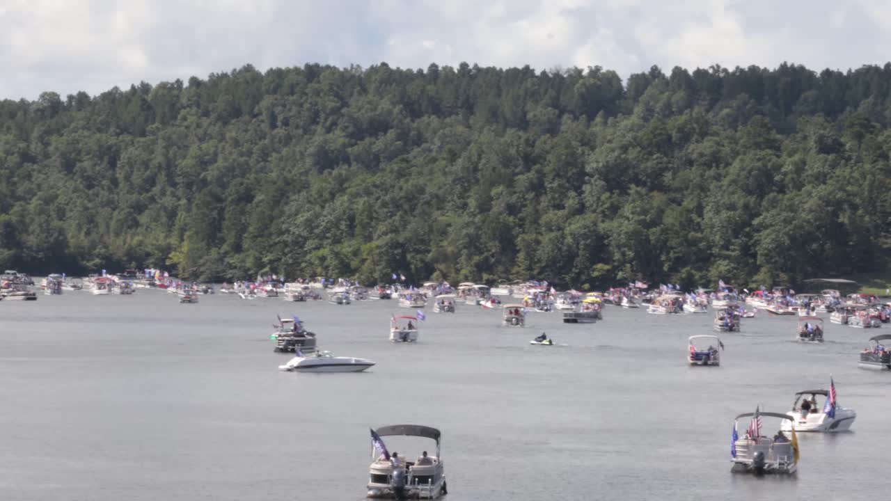 Boats decorated to support USA Trump Pence 2020. Hundreds of boats came out for the Trump 2020 boat parade on Lake Hamilton in Hot Springs.