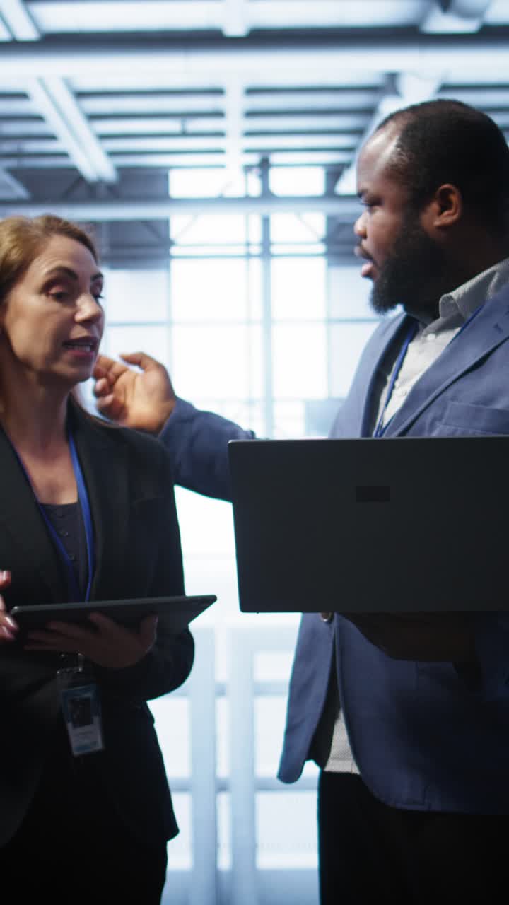 IT Professionals Shaking Hands and Collaborating in Data Center