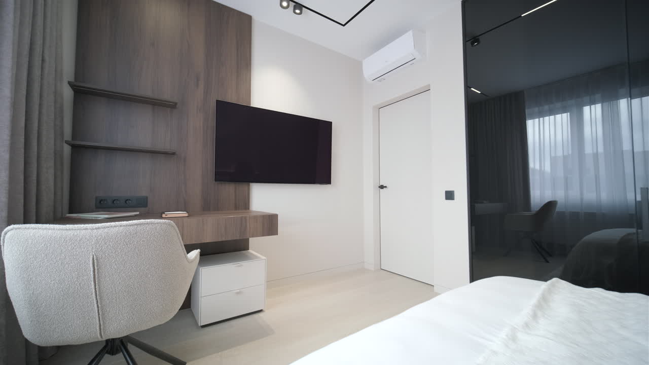Modern Bedroom Interior with Desk, Bed, and TV