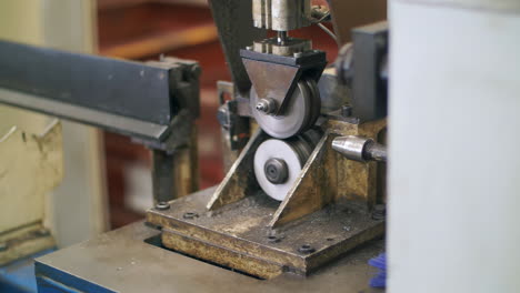 craftsman metalworker industrial experienced operator technician worker skilled machinist working intently on heavy industry in metal factory workshop with large machines