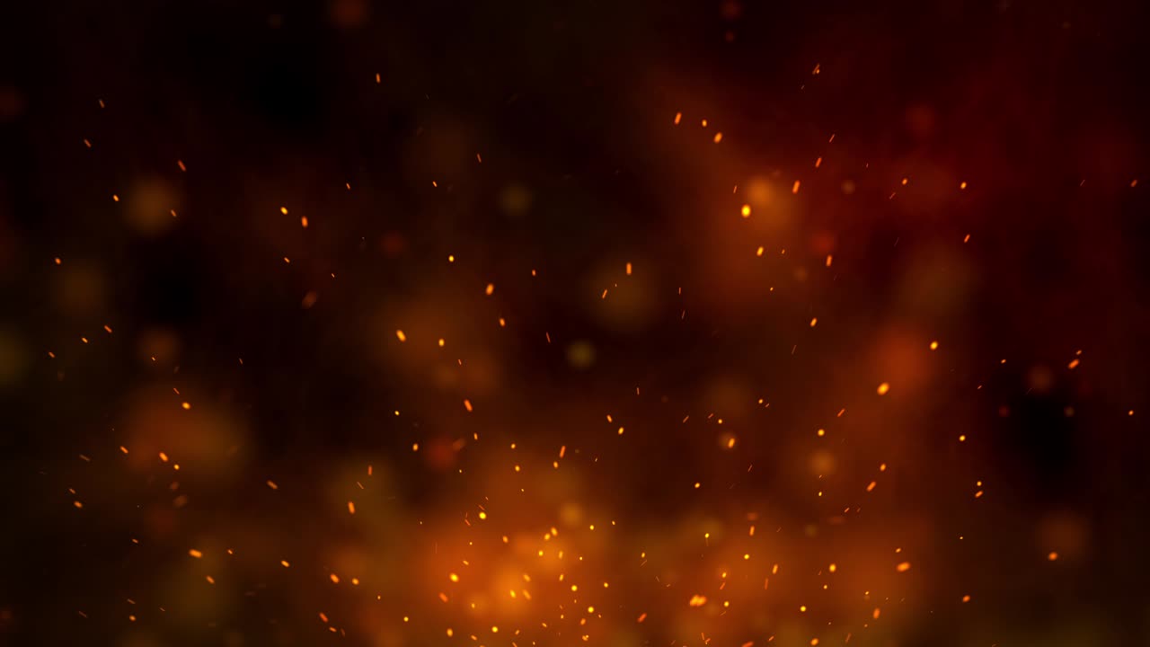 chispas ardientes que se elevan de un gran fuego y humo en el cielo nocturno.