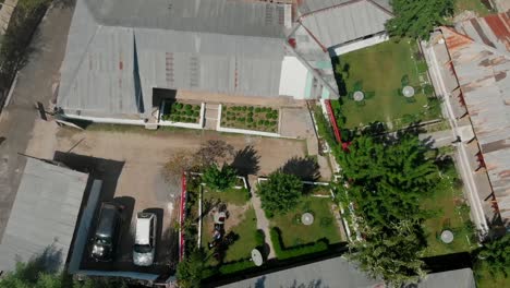 top down view over rooftops at village in kalash valley in pakistan. aerial pedestal down