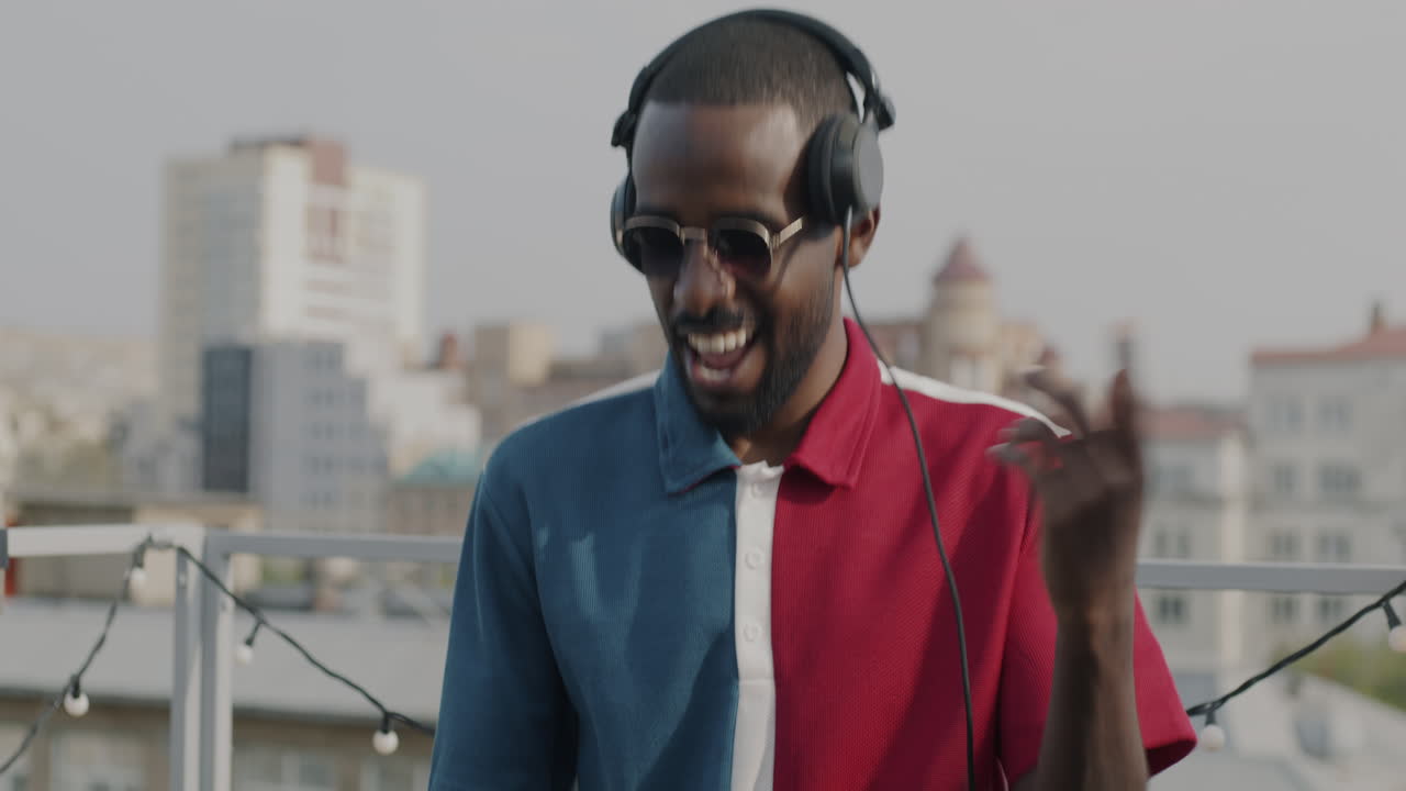 Happy DJ on a Rooftop